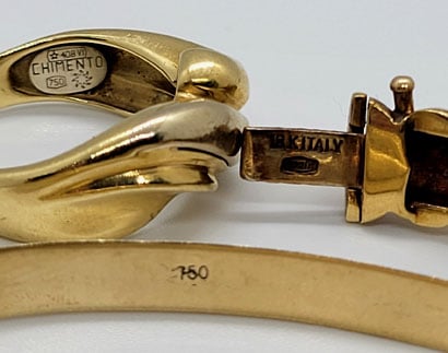 750 and 18k gold marking on a ring, bangle, and bracelet