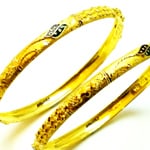 2 oriental designed 22 karat gold bangles