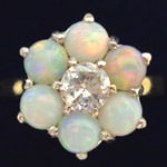 opal gold ring with center diamond