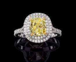 Engagement ring with a fancy, vivid yellow center diamond