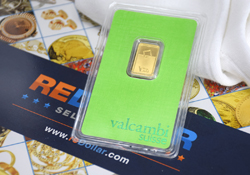 Valcambi Suisse gold bar gold ingot with reDollar flyer