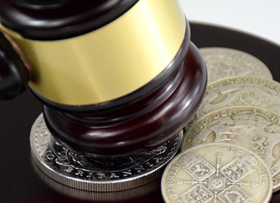 British silver coins under auction hammer