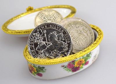British Britannia coin and Crown coins in porcelain box