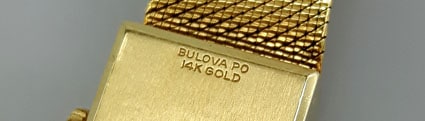 magnified 14K marking on a yellow gold Bulova Watch
