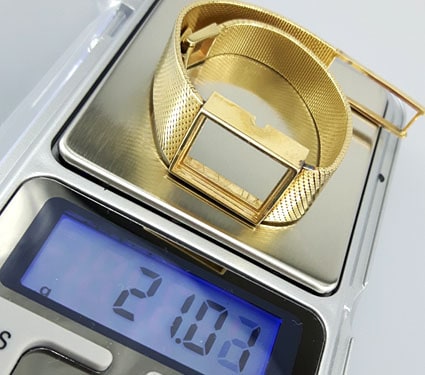 weighing a 14k gold Bulova watch bracelet with a digital scale