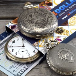 US dollars and silver pocket watches in reDollar selling envelope