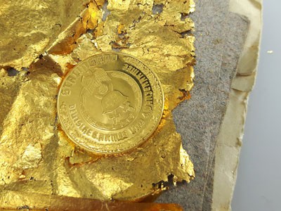 stock image: Stalingrad war gold coin and gold sheets