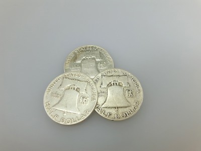 stock image: reverse of Franklin silver half dollar coins