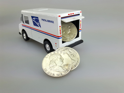 stock image: USPS truck delivering Franklin silver coins