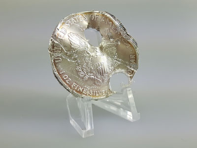 stock image: scrap silver coin, American Silver Eagle