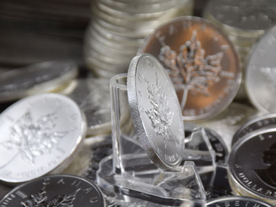 stock image: Canadian Maple Leaf coin edge and coin collection