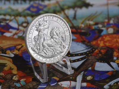 stock image: European silver coin and war scene