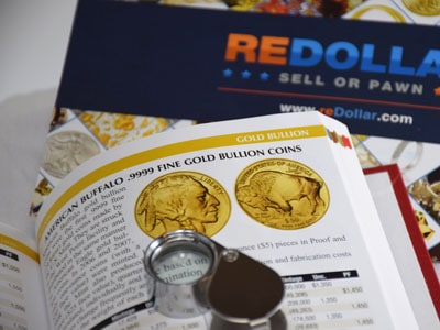 stock image: magnifier, coin literature about America Buffalo coin