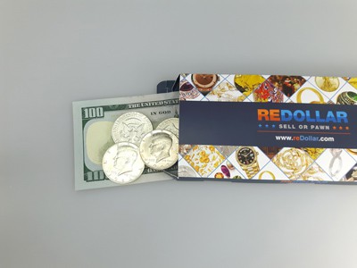 stock image: 100 dollar bill, shipping box and Kennedy dollars