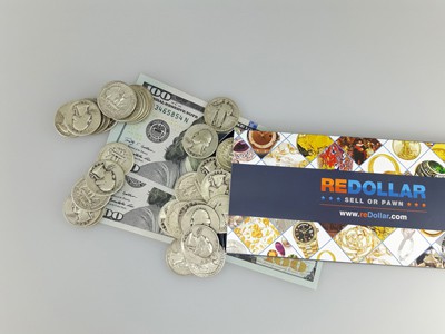 stock image: US silver coins, 100 dollar bills and shipping box