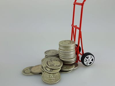 stock image: silver coin delivery and shipping with dolly