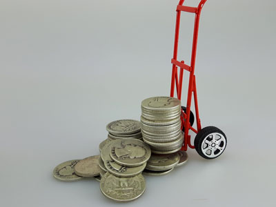 stock image: silver coin delivery and shipping with dolly