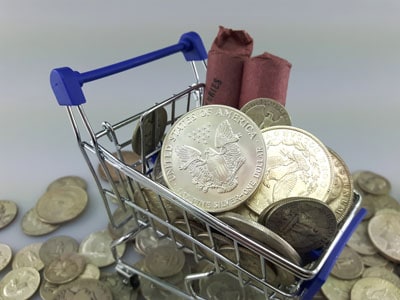 stock image: silver coin shopping with shopping cart and basket