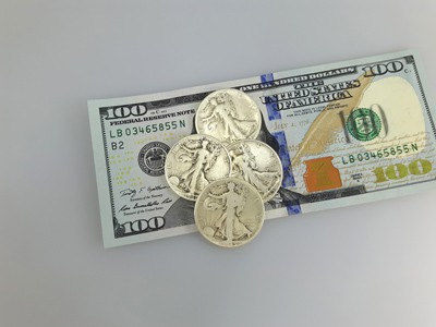 stock image: cash, 100 dollar bills and Walking Liberty silver coins