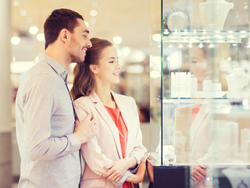 Couple shopping jewelry in a mall