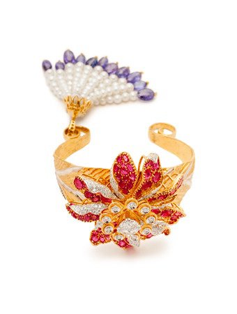 Designer bracelet with rubies, diamonds, and pearls.