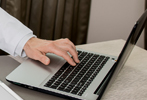 redollar expert typing on computer keypad