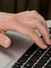 redollar expert typing on computer keypad