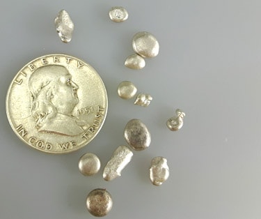 pure silver as granules hiding in a Franklin silver half dollar coin