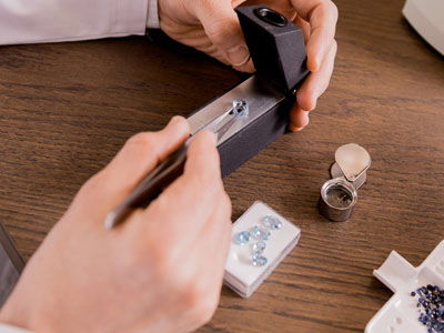 stock image: yellow gemstones examined with gem refractometer