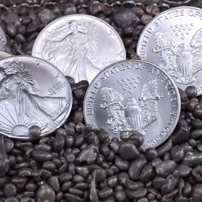 Silver Eagle coins on fine silver granules and nuggets