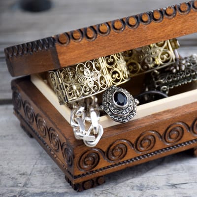 silver rings, bracelet and brooch in hand crafted wooden box