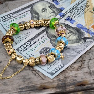 Pandora 14k gold bracelet with banknotes