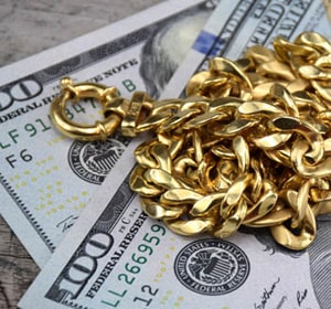 Gold chain on 100 dollar banknotes