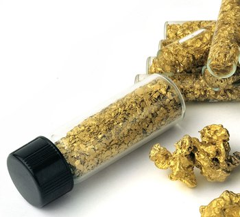 bottle filled with gold flakes and nuggets