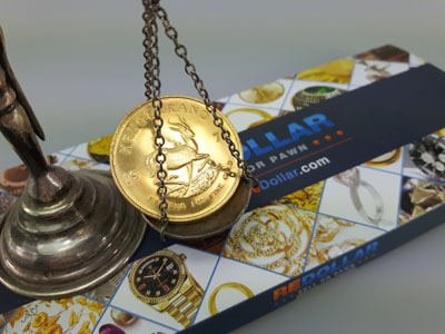 stock image: Krugerrand, gold coin, vintage scale