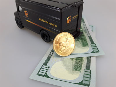 stock image: Krugerrand, cash, UPS truck, shipping, dollars