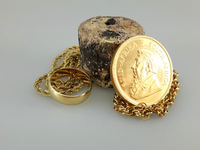 stock image: Krugerrand gold coin, melted gold, ring, gold necklace