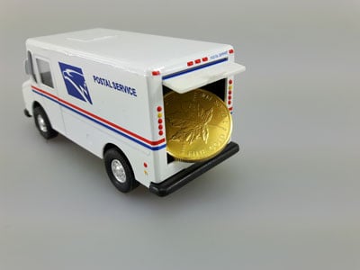 stock image: buy and sell gold coin, Maple Leaf in USPS truck