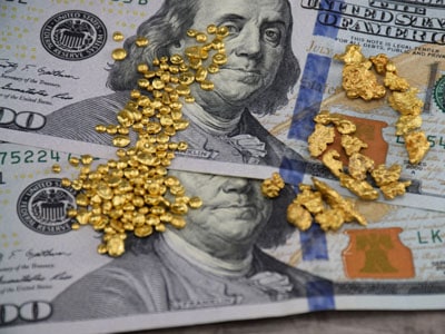 stock image: gold nuggets, natural gold, dollar bills
