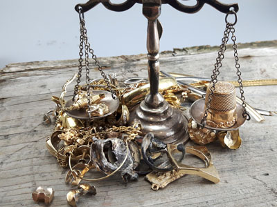 stock image: scrap gold, gold crown, melted gold, gold thimble