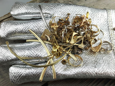 stock image: heat resistant gold-melting gloves, scrap gold