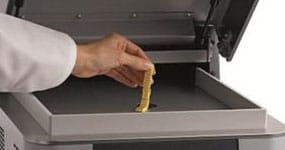 gold bracelet being tested with a precious metal testing machine 