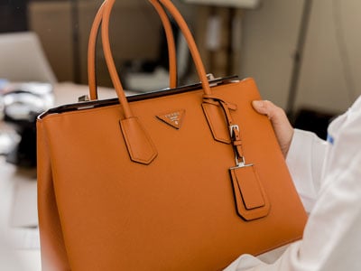 stock image: orange leather purse, designer purse from Italy