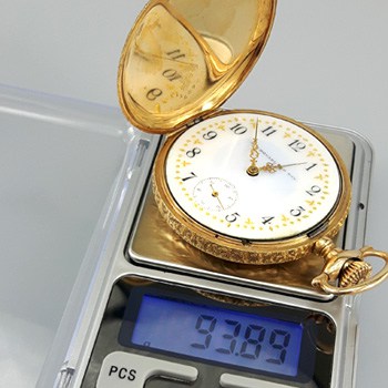 weighing a hunter case pocket watch with a digital scale