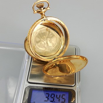 Weighing a solid gold pocket watch case for gold recovery