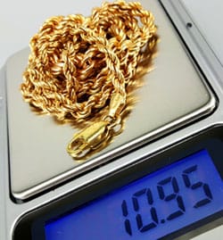 jewelry scale displaying 10.95 grams for gold chain