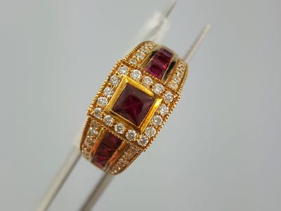 stock image: 18k yellow gold and rubies, designer ring