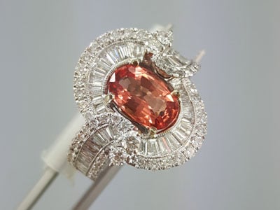 stock image: Padparadscha sapphire and diamond ring