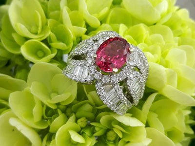 stock image: red spinel and diamond loaded white gold ring