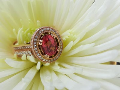 stock image: red spinel, diamond 18k rose gold ring